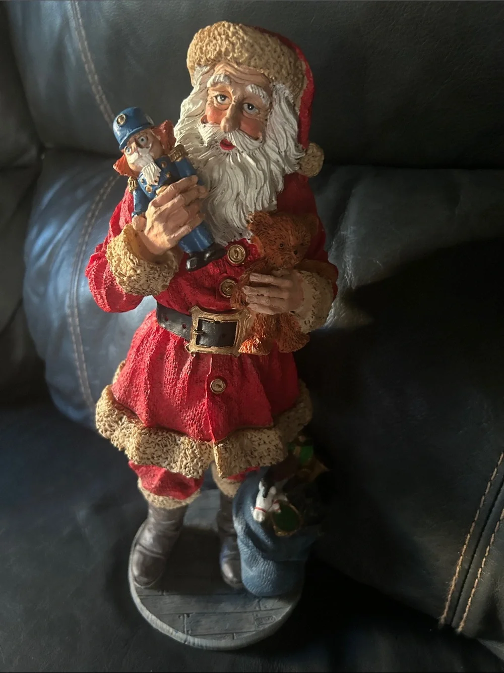 Vintage old, looking Red and Cream Santa Figurine Holding Nutcracker